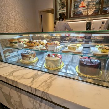Lottie - a display case of cakes and pastries - Coffee & Tea Near Me - Saint Petersburg, Florida