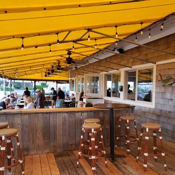 Sundays On The Bay - a restaurant with a yellow awning - Seafood Near Me - Hampton Bays, New York Sundays On The Bay - a restaurant with a yellow awning - Seafood Near Me - Hampton Bays, New York
