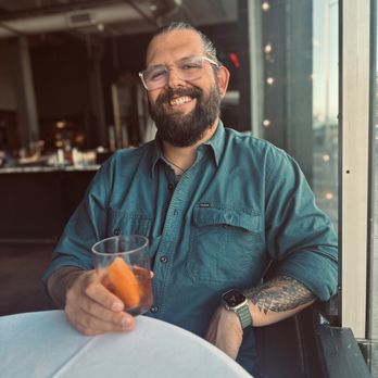 Carruthers - The hubby drinking an old fashion that was delightful! - New American Near Me - Astoria, Oregon