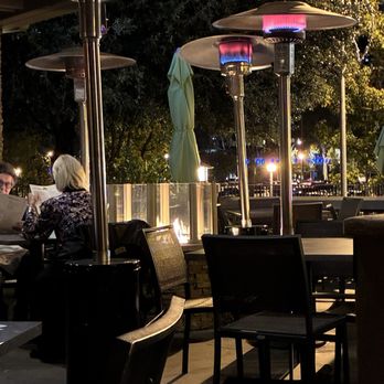 Seasons 52 - Outside patio with colorful heaters - New American Near Me - Costa Mesa, California