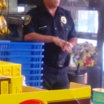 Bravo Supermarkets - a man standing in front of a toy boat - Grocery Near Me - Miami, Florida