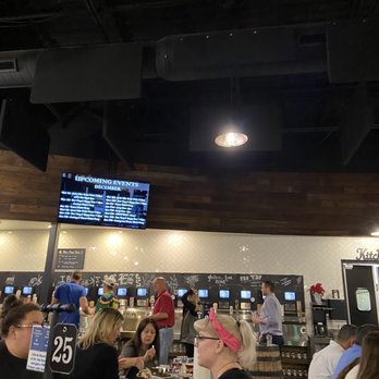 Oz. Tap House - Wall of beer and wine - Beer Gardens Near Me - Austin, Texas