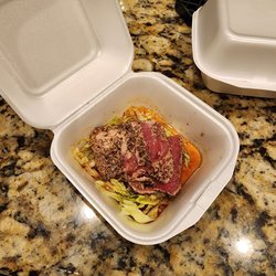 Tatsumaki Ramen & Lounge - That's a 14 tuna salad. There were a few strips of soggy iceberg lettuce underneath a few pieces of ahi, drenched soy sauce and oil.