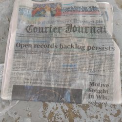 Courier-Journal Newspaper - Paper unreadable due to being drenched again tossed in driveway instead of the paper box