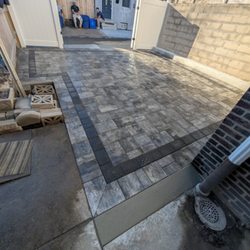 Romeo’s Remodeling & Property Solutions - paver driveway way, vinyl fence with double door opening gate system.