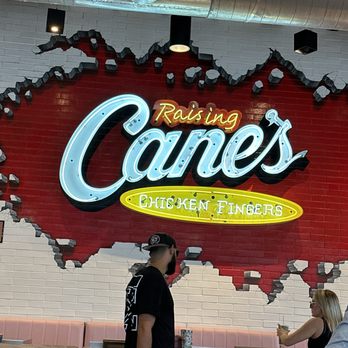 Raising Cane's Chicken Fingers - Logo design on the wall is pretty cool - Fast Food Near Me - Miami Beach, Florida