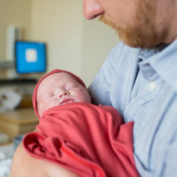 Ashley Strong Photography - Dad holds his baby girl - Event Photography Near Me