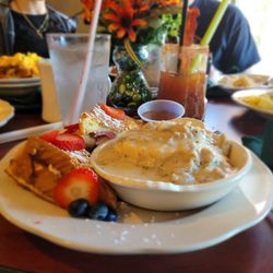 The Links Restaurant - Stuffed French toast  with a side of a biscuit with homemade sausage and gravy!