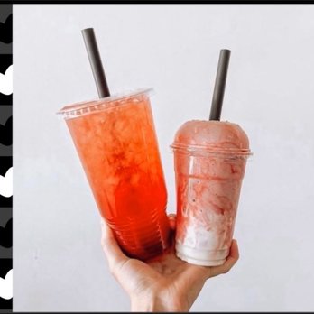Luv Nutrition - a hand holding two drinks - Cardio Classes Near Me - Pasadena, Texas