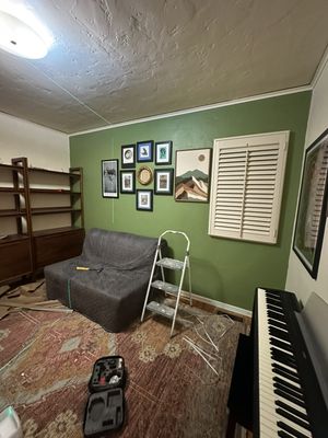 Interior painting - Repainting of the office and hallway, assembly and installation of shelves, hanging of paintings according to the client’s design plan.