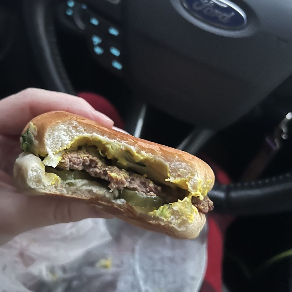 Hamburger with mustard, lettuce, onion & pickles Hamburger with mustard, lettuce, onion & pickles