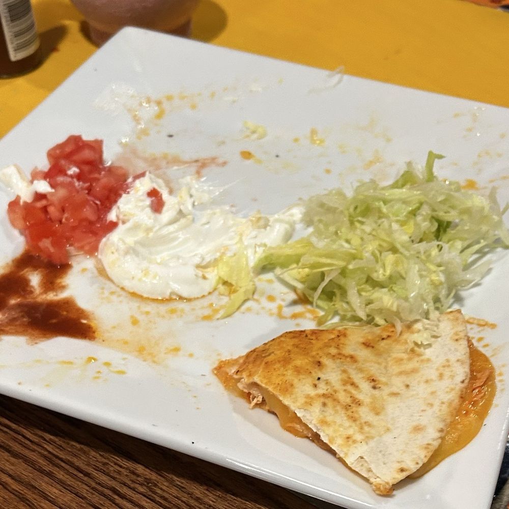 Chicken quesadilla almost finished. Chicken quesadilla almost finished.