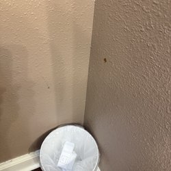 Los Lagos at Hot Springs Village a Ramada by Wyndham - Wall next to toilet. Blood or??