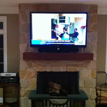HD - 55 inch mounted on stome fireplace. Electrical outlet behind TV and concealed wiring through the stone. - Home Theatre Installation Near Me - La Jolla, California