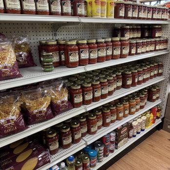 Mazzilli Farm Stand - Grocery store shelf stocked with jars of pasta sauce, including Mazzilli brand, and other food products like pasta and condiments. - Fruits & Veggies Near Me - Wareham, Massachusetts