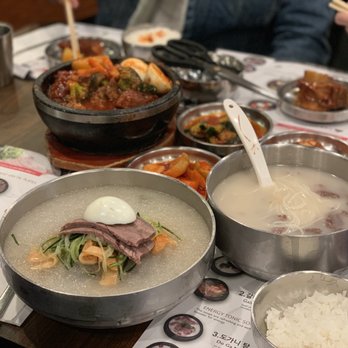Kunjip - Back: Spicy galbi-jjim Front left: Mul naengmyun Middle right: Sulung tang (before we put in salt and green onion) - Korean Near Me - Santa Clara, California