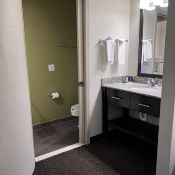 Sleep Inn - Vanity sink area looking into toilet/shower area - Hotels Near Me - Flagstaff, Arizona Sleep Inn - Vanity sink area looking into toilet/shower area - Hotels Near Me - Flagstaff, Arizona