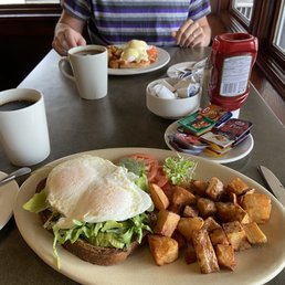 Avocado toast in front, smoked salmon eggs Benedict in the back. Avocado toast in front, smoked salmon eggs Benedict in the back.