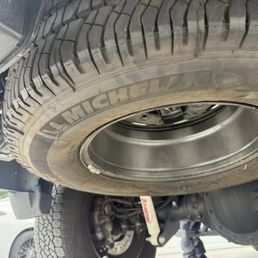Tire is upside down and loose, this thing could have fell off and caused an accident!