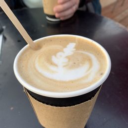 a cup of coffee on a table a cup of coffee on a table