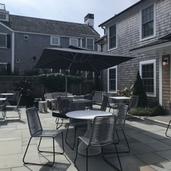 The Edgartown Inn at the Edgartown Collection - Courtyard seating, with large umbrella and fire pit