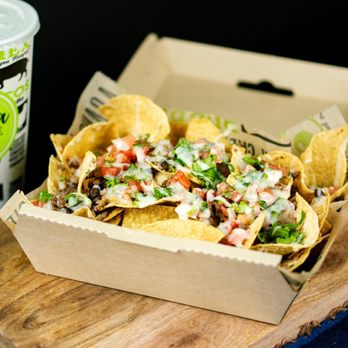 Guaca-Mole - a box of nachos and a drink - Mexican Near Me - Doral, Florida Guaca-Mole - a box of nachos and a drink - Mexican Near Me - Doral, Florida