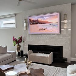 H2 Audio Video - 85" Samsung Frame with Rose Gold Bezel mounted using a flush motorized mount. We specialize in custom installation. Contact us TODAY!!