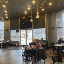people sitting at tables people sitting at tables