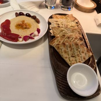 Avra - complimentary bread platter w/ hummus - Greek Near Me - New York, New York