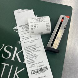 Green Acres Sporting Goods - Sales receipt and clip.