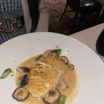 The Capital Grille - Pan-Seared Sea Bass with Shiitake Mushrooms, Asparagus and Miso Butter - Steakhouses Near Me - Denver, Colorado The Capital Grille - Pan-Seared Sea Bass with Shiitake Mushrooms, Asparagus and Miso Butter - Steakhouses Near Me - Denver, Colorado