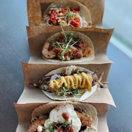 Salmon, fish tacos, shrimp and grits, chicken and waffles taco Salmon, fish tacos, shrimp and grits, chicken and waffles taco