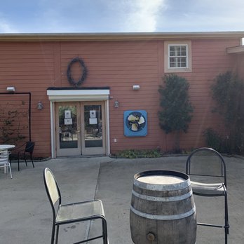 Silver Coast Winery - a patio area with chairs and a barrel - Wineries Near Me - Ocean Isle Beach, North Carolina Silver Coast Winery - a patio area with chairs and a barrel - Wineries Near Me - Ocean Isle Beach, North Carolina