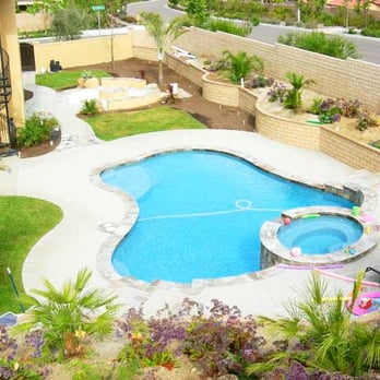Coxco Builders - Whole yard makeover. Hardscape, retaining wall, planting beds, fire pit, deck, exotic palm trees, drought tolerant plantings. - General Contractors Near Me Coxco Builders - Whole yard makeover. Hardscape, retaining wall, planting beds, fire pit, deck, exotic palm trees, drought tolerant plantings. - General Contractors Near Me