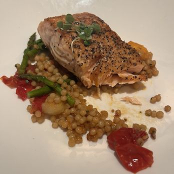 The Capital Grille - Delicious medium salmon in couscous w asparagus and baby tomatoes - Steakhouses Near Me - San Antonio, Texas
