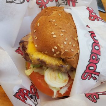 Hodad's - Don't let this picture fool you, there is a crap load of onion behind the tomato! - Burgers Near Me - San Diego, California Hodad's - Don't let this picture fool you, there is a crap load of onion behind the tomato! - Burgers Near Me - San Diego, California