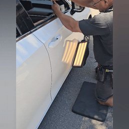 Brian removing dent.