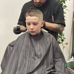 Nick's Barber Shop - My son Loyal getting his haircut. He has hard cowlicks and Nick knows just how to neutralize them...