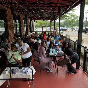 Newk's Eatery - Ladies doing interactive activity on the patio. Full patio of 36 people. - Salad Near Me - Gambrills, Maryland