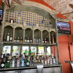 a bar with a variety of liquors