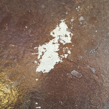 Bella's Landscaping - Chipping on concrete stain - Landscaping Near Me