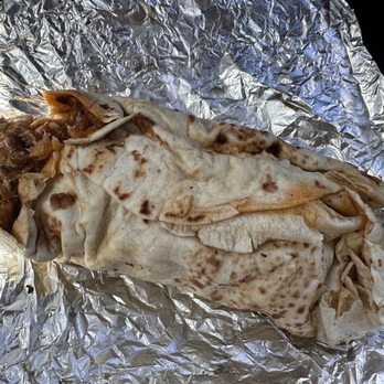 El Chile Toreado - Unwrapped chorizo burrito... so good! 4/10/2023 - Mexican Near Me - Santa Fe, New Mexico