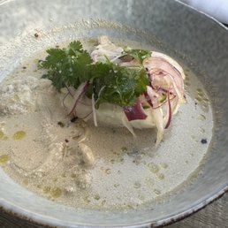 Steamed fish in coconut broth with lion's mane mushrooms. Steamed fish in coconut broth with lion's mane mushrooms.