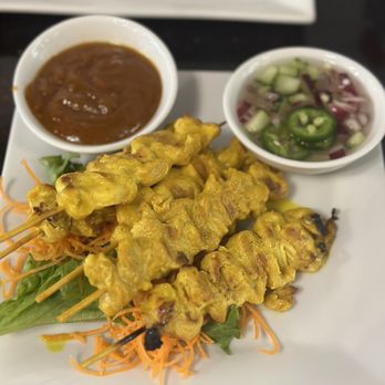 Bangkok At Beltline - Chicken satay - marinated and skewered, served with two really delicious sauces - Thai Near Me - Richardson, Texas Bangkok At Beltline - Chicken satay - marinated and skewered, served with two really delicious sauces - Thai Near Me - Richardson, Texas