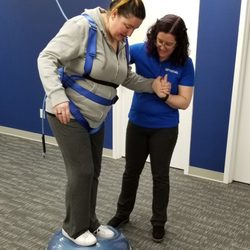 FYZICAL Therapy and Balance Centers - West Caldwell - Bosu balance exercise in Safety Overhead System harness