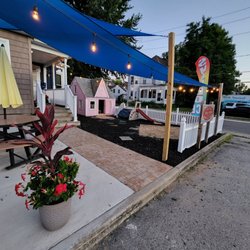 Westcott's Arctic Shaved Ice - Seating area with shade sail and ambient lighting.