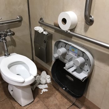 Walmart Supercenter - a toilet and a trash can - Grocery Near Me - Greenville, North Carolina