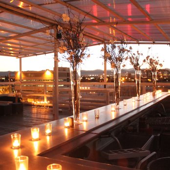 Bar Standard - a long table with candles on it - Dance Clubs Near Me - Denver, Colorado Bar Standard - a long table with candles on it - Dance Clubs Near Me - Denver, Colorado
