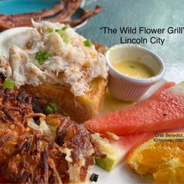 Crab Benedict with hollandaise sauce on the side.