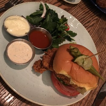 Yardbird - $16 Crunchy Yardbird Sandwich - hot-sauce, lettuce, heirloom tomato, house pickles, buttermilk ranch dressing, w/ side salad, okra & pickle - Southern Near Me - Las Vegas, Nevada